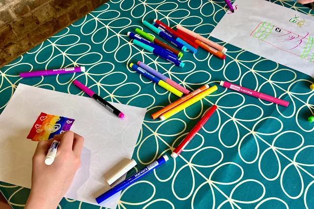 Children at a table using Marvin's Amazing Magic Pens