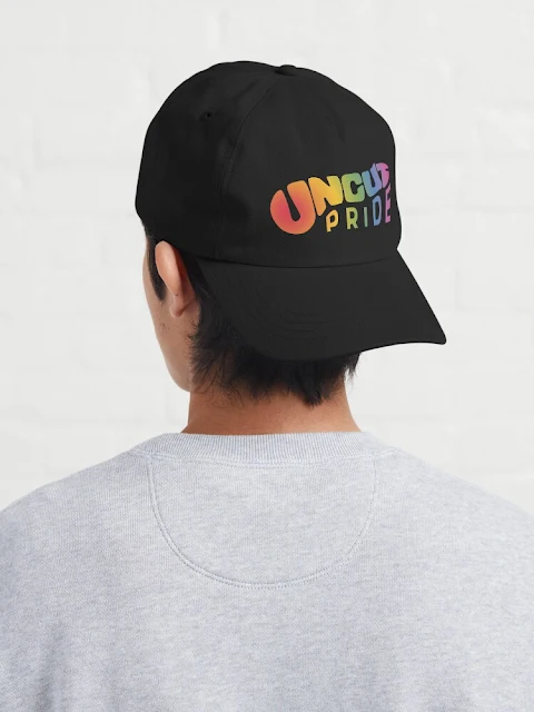 Uncut Pride text hats.