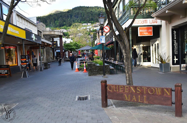 shops, tables and chairs at outdoor mall