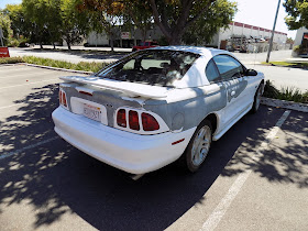 Peeling paint on Ford Mustang when it arrived at Almost Everything Auto Body.