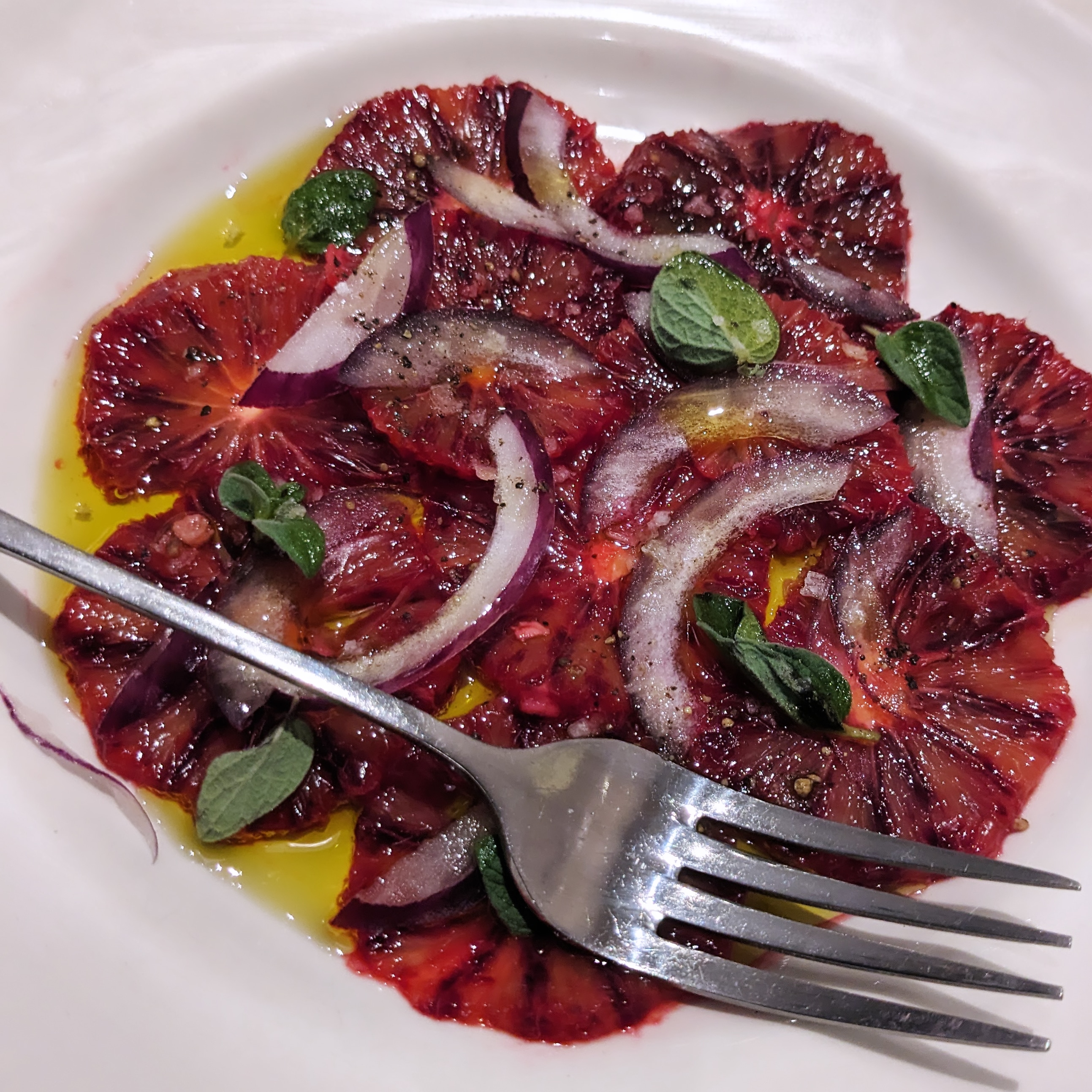 a plate of thinly sliced blood oranges with onion at boca di lupo, one of the most authentic italian restaurants in london