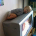 Funny Kid Sleeping on Televisions