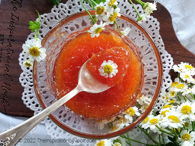 Small batch peach jam with a teaspoon on a white doily surrounded by camomile flowers, small batch peach jam without pectin, peach jam low sugar, low sugar peach preserves, low sugar peach preserves no pectin, peach jam less sugar