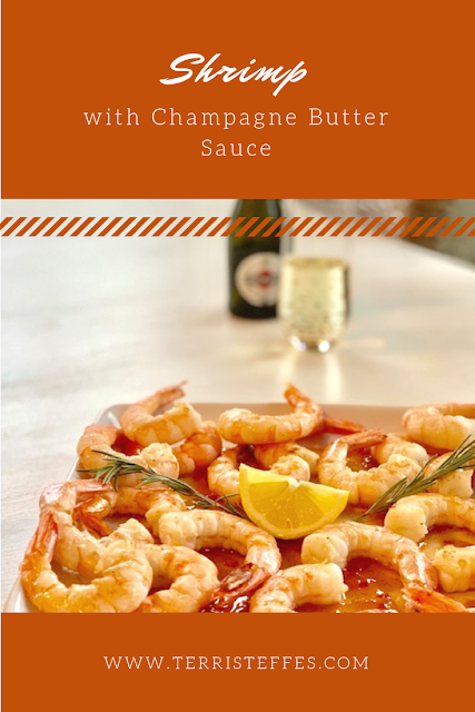 A beautiful dish of shrimp sitting on a bed of Champagne Butter Sauce.