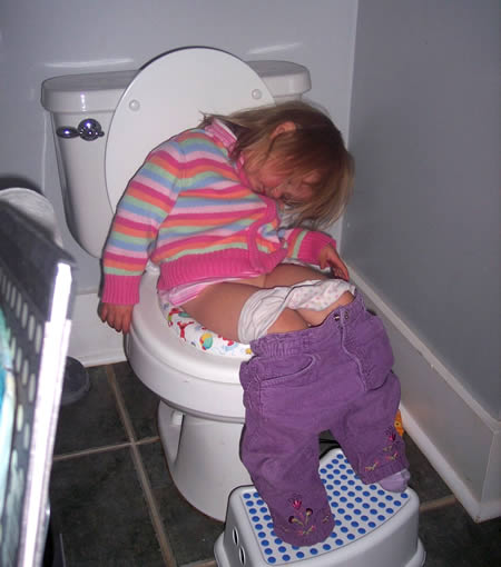 funny baby sleeping in toilet