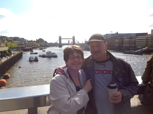 Holly and Pierre pose in front of London Bridge on a recent visit to the U.K.