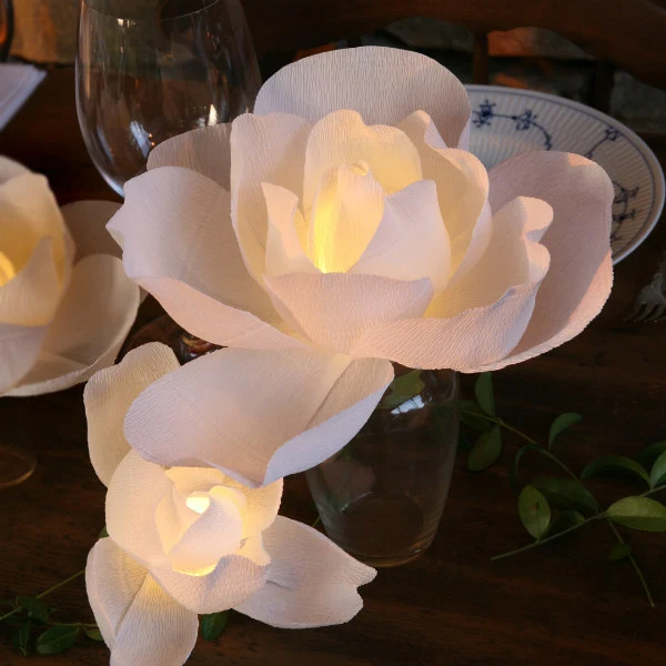 white paper lighted magnolia centerpiece