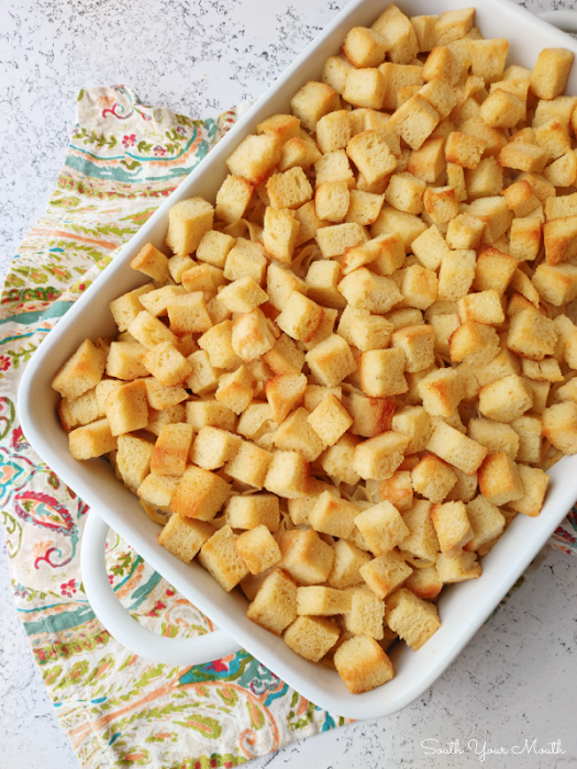 Cupboard Casserole! A super quick and easy casserole recipe using canned chicken, egg noodles and cream soup – all items from your cupboard or pantry! – topped with buttered bread cubes then baked until toasty.