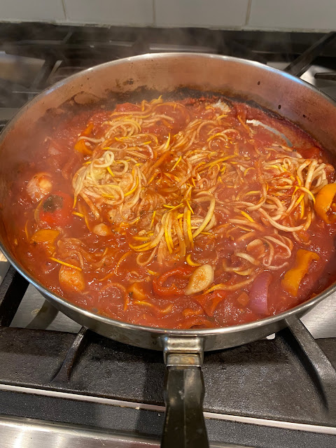 zucchini spaghetti is a skillet with marinara sauce