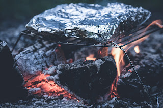 Barbecue wrapped with aluminium foil  can be dangerous