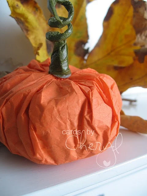 tissue paper pumpkin on shelf