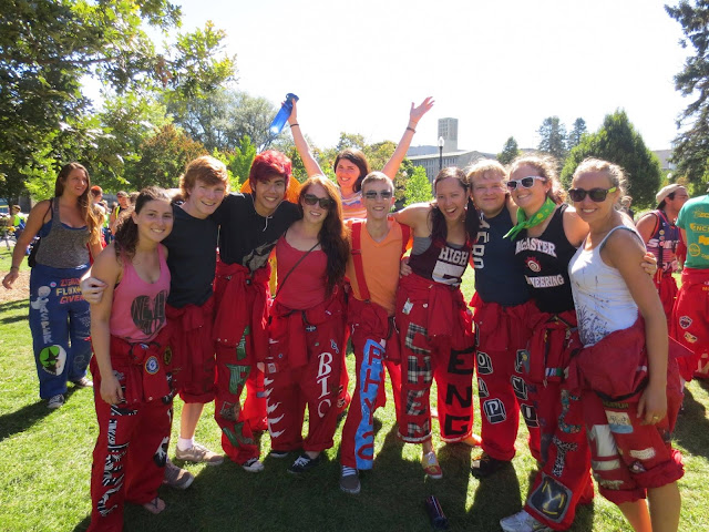 Tired, but happy redsuits posing for a picture.