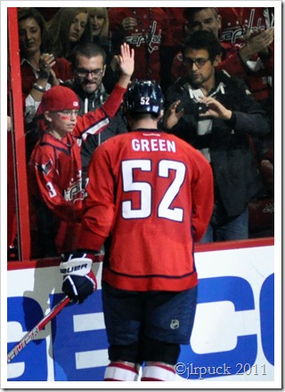 Giving a young fan a puck