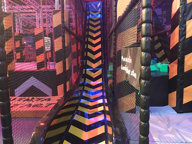 yellow and black striped indoor slide at Jump 360 Newcastle trampoline park