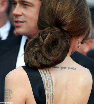 Angelina Jolie adds twins' birth coordinates to tattoo collection