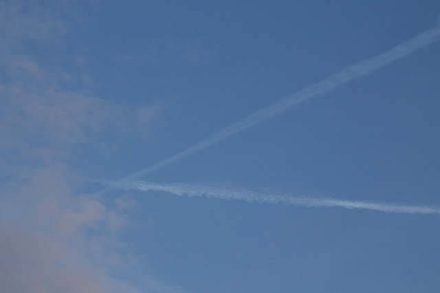 morning sky with clouds and chemtrails