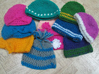 Sweet Nothings Crochet free crochet pattern blog ; photo of all the beanies made for donation