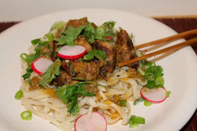 Serving plate of hot and sour rhubarb pork.