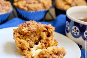 image of sweet potato casserole whole grain muffins on a plate, served with melted butter