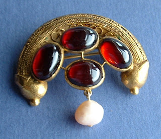 https://timewasantiques.net/products/etruscan-revival-brooch-22kt-gold-genuine-garnets-pearls-1860s-pin-han