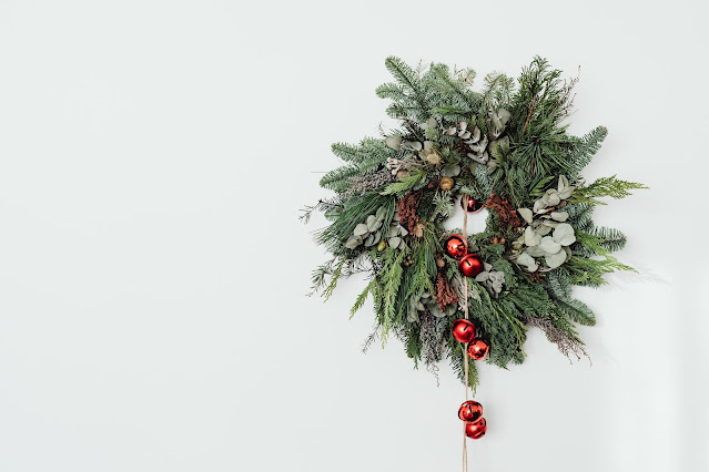 a christmas wreath hanging on a wall