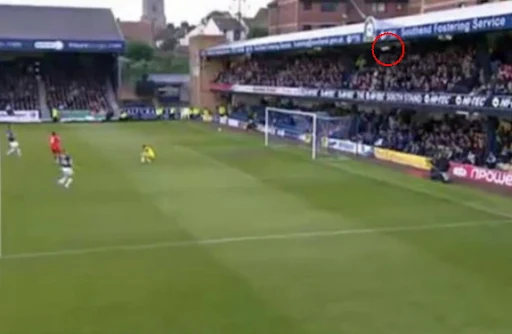 The ball kicked by Crewe's Byron Moore ends up in the stand behind the goal