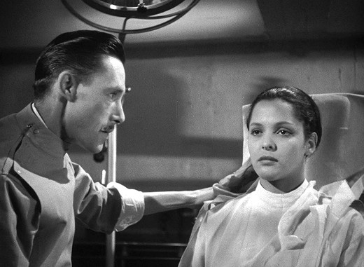 John Carradine and Acquanetta in Captive Wild Woman, 1943