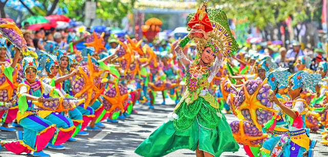 People Wearing Colorful Dresses to Celebrate Sinulog Festival