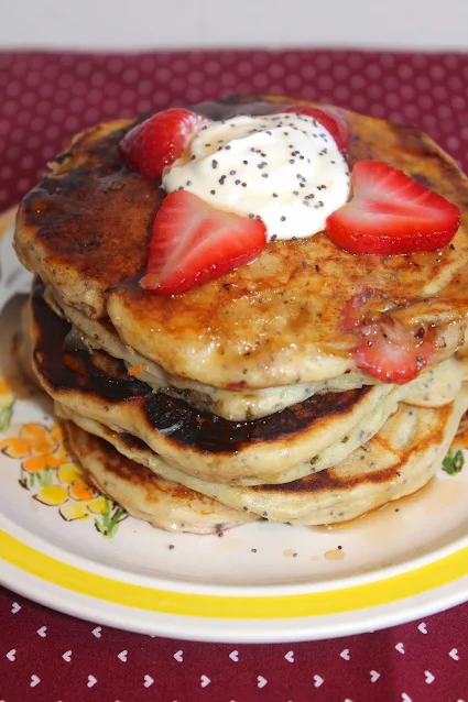 Stack of strawberry sour cream poppy seed pancakes.