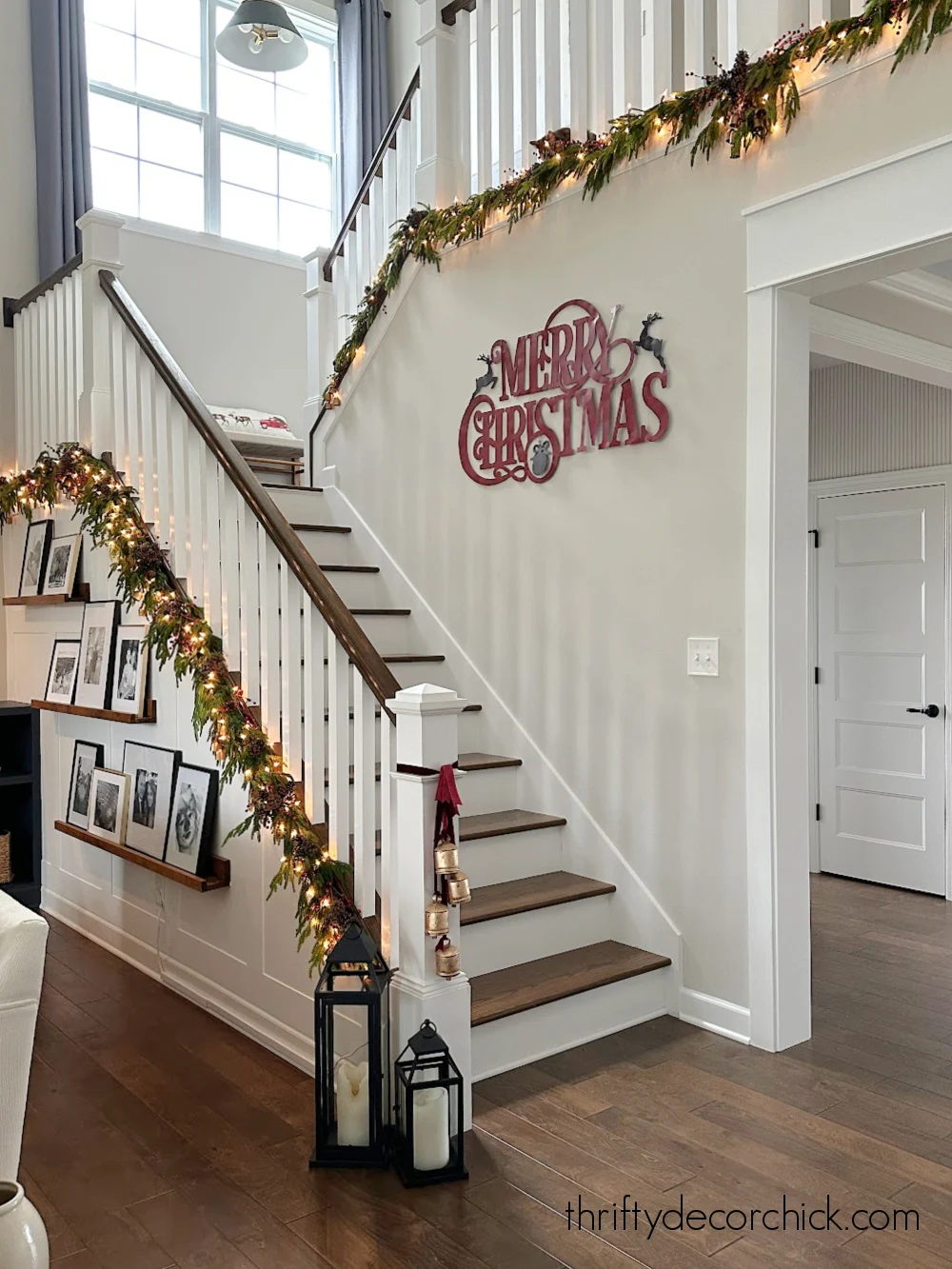 white stained stairs with garland