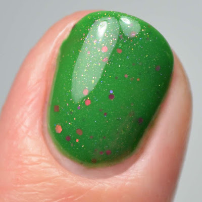 green nail polish with glitter close up swatch