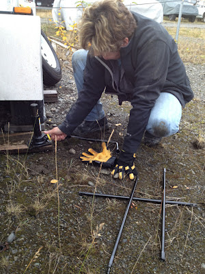 Image of woman fixing flat tire