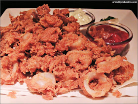 Fried Calamari: Fried Light and Crisp. Served with Garlic Dip and Cocktail Sauce.