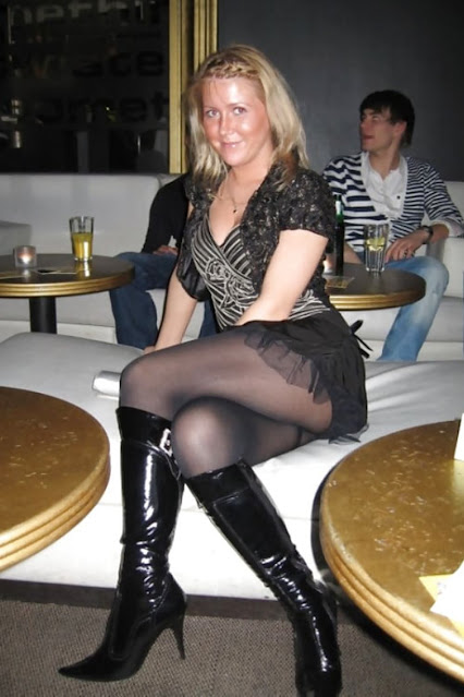 Woman in miniskirt, boots with pantyhose