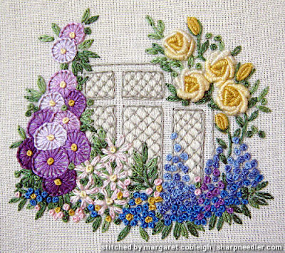 Elizabethan Window (by Roseworks): Completed embroidered window surrounded by flowers