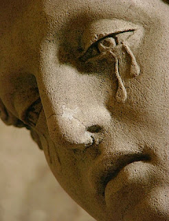weeping stone statue