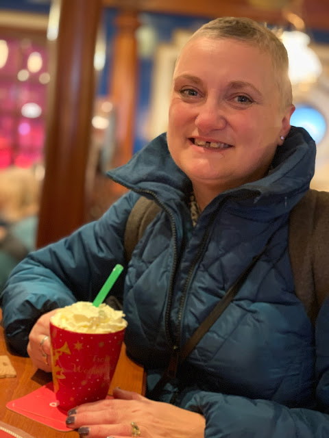 madmumof7 drinking cream topped hot chocolate at German Christmas Market