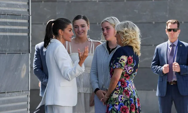 Queen Letizia wore a suit by Carolina Herrera, and Cylani silk shirt by Hugo Boss. Jil biden wore a floral dress by Oscar de la Renta