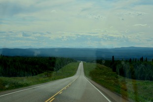 utter boredom as we leave Fort Nelson, although I see mountains in our future