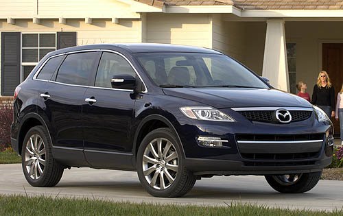 Front 3/4 view of 2011 Mazda CX-9 parked in front of house