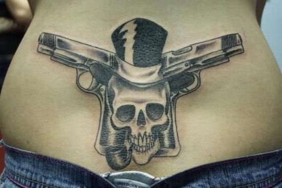 skull tattoo for girls. girls with guns and tattoos.