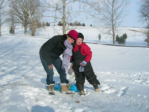 Q & mommy getting ready to sled