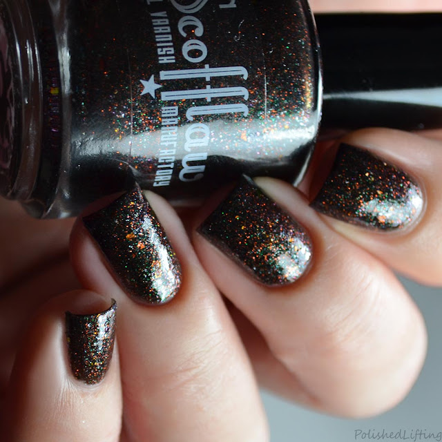 black nail polish with halloween micro glitter