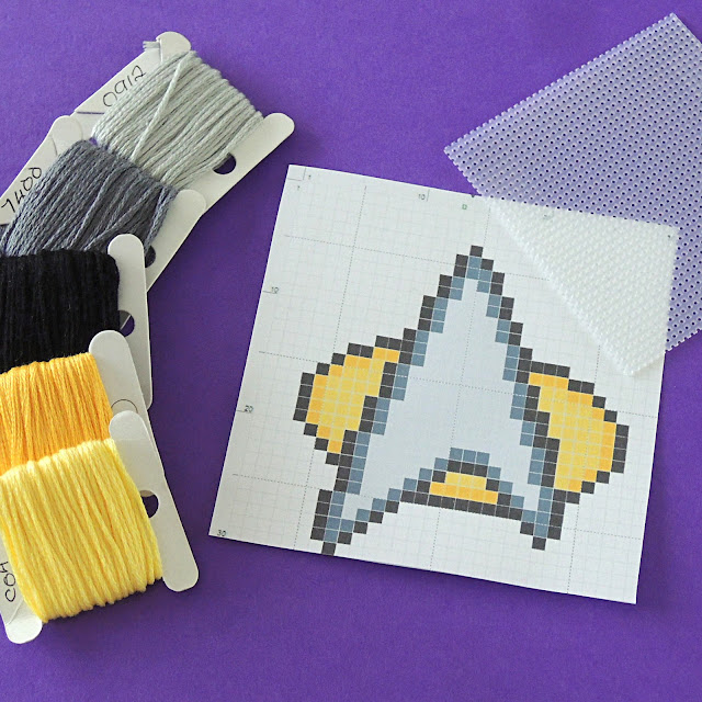 DMC threads in yellow, black and grey, Star Trek Insignia Cross Stitch Chart and plastic canvas