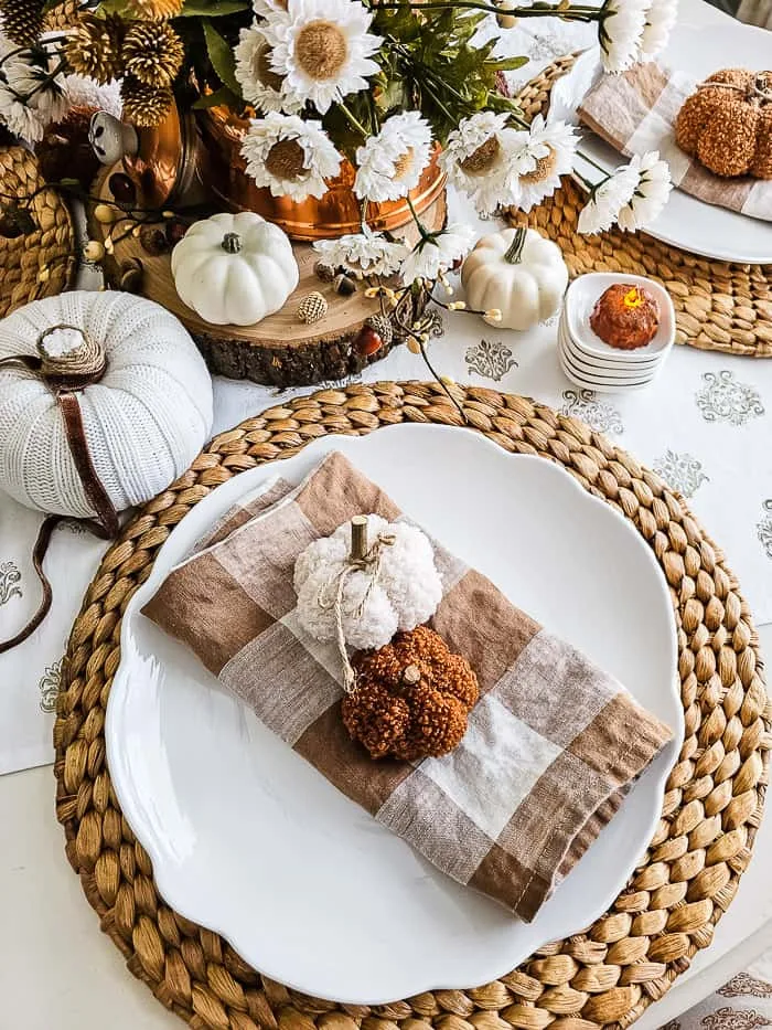 white pumpkins, rattan chargers, copper kettle, thistle stems