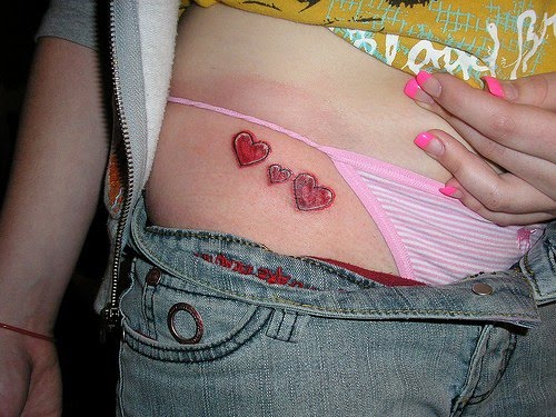 girl star tattoos on hip. heart and stars tattoos for