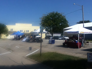 street scene with tents and people