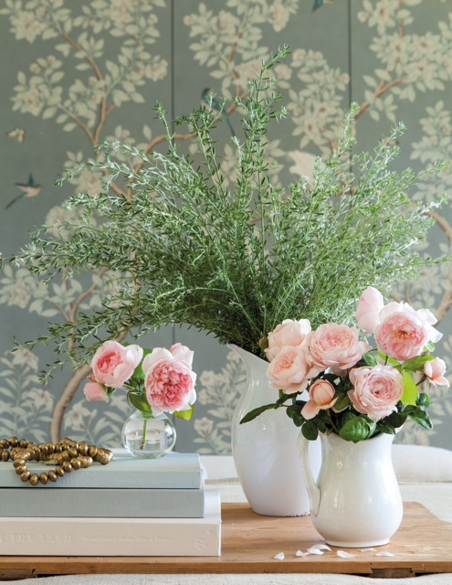 Patina Farm pink roses in white ironstone vases with Gracie wallcovering in background