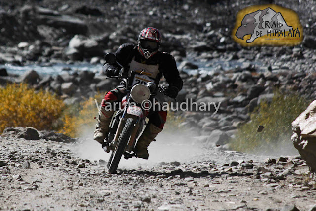 After extreme action of cars at Raid de Himalaya, it's time to have a PHOTO JOURNEY of Bikers. Usually bikes are more interesting to click as compared to cars, but in Raid everything is super exciting !!! Let's start this journey with bikes in action....This whole event is very well planned and everyone is well aware of actions to be happen during the week of Raid. I was really amazed to see the detailing of event at http://www.raid-de-himalaya.com/2011/Xtreme/supregs2w2011.pdf . I have seen documents of other motorsports in North India and most of them are really disorganized and planned very unprofessionally. The whole team of Himalayan Motorsports work really hard to make each thing very special and safe !!!Bikes are really specially for shooting and panning is one of the technique, which can't be missed during such events where bikers love to fly in air...Raid de Himalaya started from Peterhoff Hotel, Shimla and day one ended at Manali through Jalori Pass !!! Whole route was like  Shimla to Manali == Manali-Leh(via Sarchu) ==Leh-Leh(via Wari La & Khardung La) == Leh-Rangdum(via Kargil) == Rangdum-Rangdum(via Padum) == Rangdum-Srinagar(via Kargil)Himalayan Motorsports organize this wonderful event and here are some contact details -Himalayan MotorsportMotoworld, Navbahar, Shimla,Himachal Pradesh - IndiaPhone: +91 (0) 177 2842916Fax: +91 (0) 177 2844338Email: info@raid-de-himalaya.comTotal distance covered was 2200 kilometers, including 667 kilometers of competitive sections. 667 Kms were covered during 11 different competitive stages. The Moto Alpine was about running the first 3 legs of the rally and end at night haltof leg 3 at Leh. This shorter version was open to all newcomers to the Raid de HimalayaOnly those that had never participated before in the Raid (on a / Quad) are eligible tenter for the Moto Alpine.The Moto Xtreme was complete version of the Raid de Himalaya, running all 6 legs anwas open to both previous participants as well as the new entrants to the Raid, In shorwhereas a previous participant could not enter the Moto Alpine...Bikes of 100cc to 700cc participate in Raid and all of them are categorized into different classes, on the basis of their machine powers.Most of these folks used some imported bikes or modified versions of high power bikes. On top of that each biker needs to have a team to ensure that any break-down on the way can be fixed as quick as possible.Another special thing about these motorsport rallies is their route. Most difficult terrain are chosen with appropriate safely measures in mind. In fact, security planning takes various months to finalize things with Government and private agencies. All riders in Raid are really disciplined about safely as well. Following passion with proper safely measures is also very important.Raid de Himalaya rally passes through various villages in Himachal Pradesh and Jammu & Kashmir !!!Riding on such a road is a real luxury. At various points it's difficult to find the road on rough hills with landslides and water streams around !!! Riding bike in Raid is really difficult as riders have no option of driving the vehicles by sitting on closed cabins. Weather is another challenge for bike riders in Raid de HimalayaSome information picked from official Facebook page of RAID DE HIMALAYA Raid de Himalaya is among the most extreme motor sport events organized at an international level. It runs on the highest altitudes as compared to others including the Paris Dakar Rally. http://www.raid-de-himalaya.com/Mountains and Bikes seem to be made to be seen together. Several Indian travellers have now started taking on the mountains on their bikes. The main reason is the same as the the bikers participating in the rally - the thrill of scaling these heights.Navigating the curves, dodging the rocks, and leaving a dust trail, the riders manoever their mean machines faultlessly and spectators can't do much but stare at them with awe.They look the same at a glance, but all riders have their own unique techniques that only experts can detect.Amongst the barren, brown hills the only streaks of colour are these motorbikes. For the duration of the rally, the region comes alive with these dashing, roaring machines.In spite of the tiring route that not only makes you push the boundaries of your schools, each biker starts longing to return for another ride, another adventure soon after one is over.Rearing and roaring like a wild beast, these bikes are merely pets in their riders' hands, obeying each command, following each direction to the last letter.Once the race is over and the bikers have left, the hills lie forlorn, full of longing for these noisy destructive forces of technology to come and make them come alive again.The heights seem scalable and the terrain no longer a foe, when you are flying on your machine. No wonder each biker comes back year after year to scale these heights till they become as familiar to them as the back of their hands. 