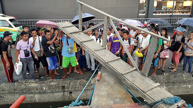 undisciplined passengers going to Basey already crowding the dock at Tacloban Port, even as the boat approaches